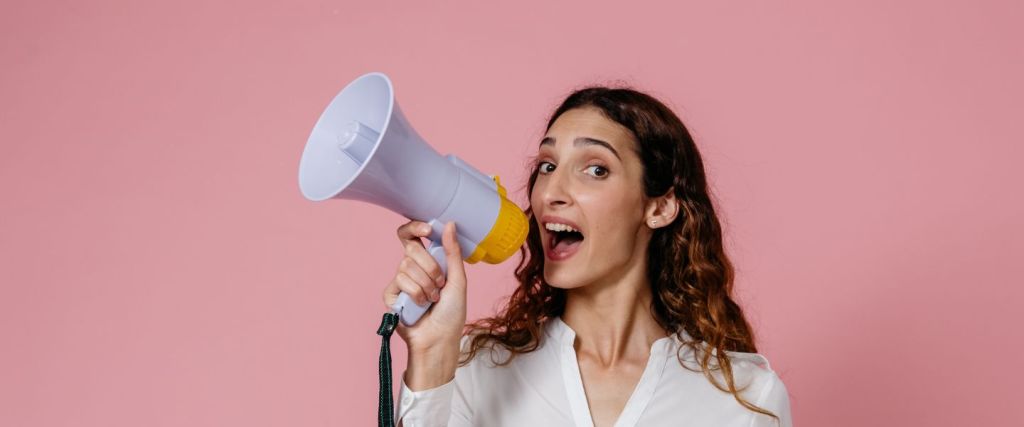 Level 4 name change announcement - woman with speaker phone