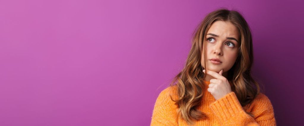 Lady in orange jumper confused
